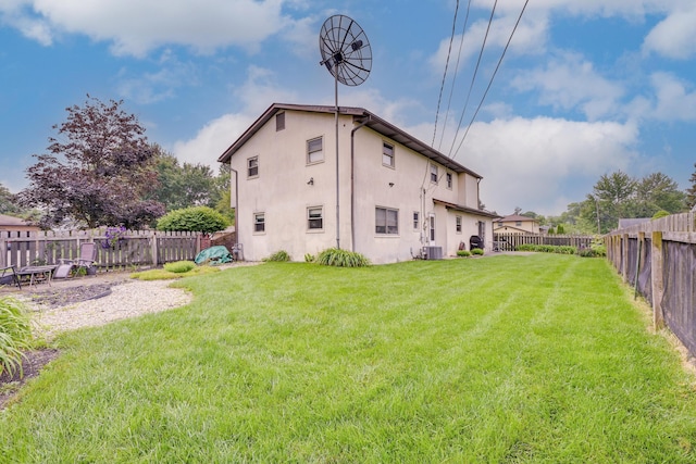 4909 Vanlear Rd, Columbus, OH 43229 - rear view of house featuring stucco siding and central AC
