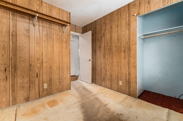 5045 Labelle Dr, Columbus, OH 43232 - unfurnished bedroom featuring carpet flooring and wood walls