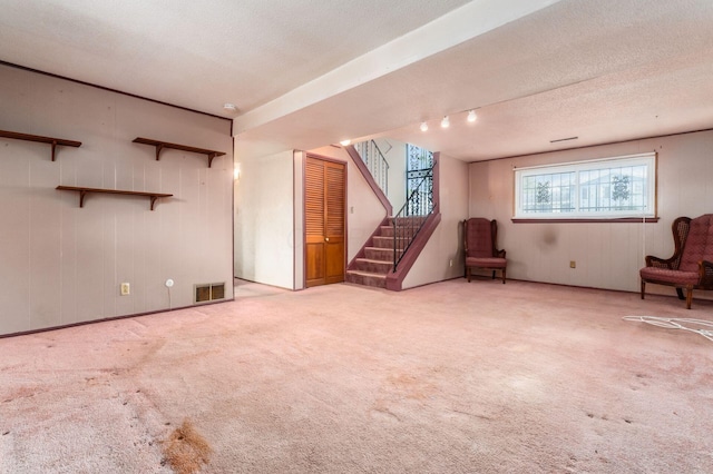5045 Labelle Dr, Columbus, OH 43232 - basement with stairway, carpet, and a textured ceiling