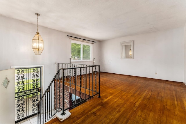 5045 Labelle Dr, Columbus, OH 43232 - empty room featuring a chandelier and hardwood / wood-style flooring