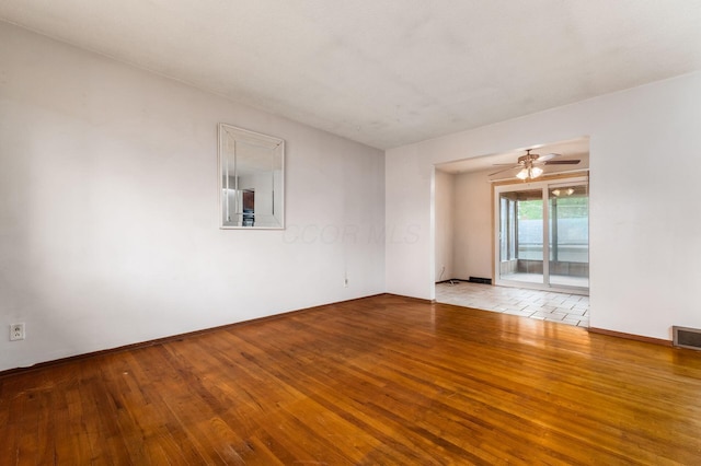 5045 Labelle Dr, Columbus, OH 43232 - empty room featuring hardwood / wood-style flooring, a ceiling fan, and baseboards