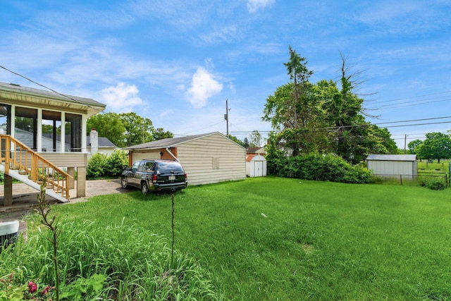 5045 Labelle Dr, Columbus, OH 43232 - view of green lawn with a sunroom and stairway