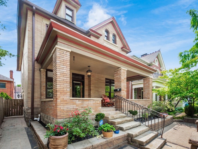 471 W 4th Ave, Columbus, OH 43201 - view of front of property with brick siding and covered porch
