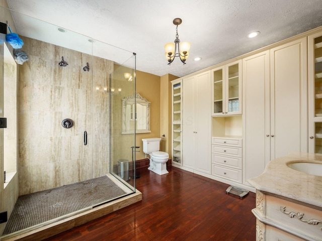 471 W 4th Ave, Columbus, OH 43201 - bathroom with a stall shower, hardwood / wood-style floors, vanity, a chandelier, and recessed lighting