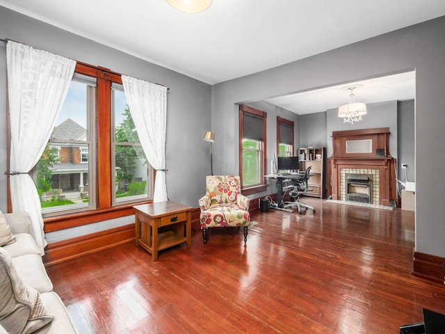 471 W 4th Ave, Columbus, OH 43201 - living area featuring hardwood / wood-style flooring, a chandelier, and a tile fireplace