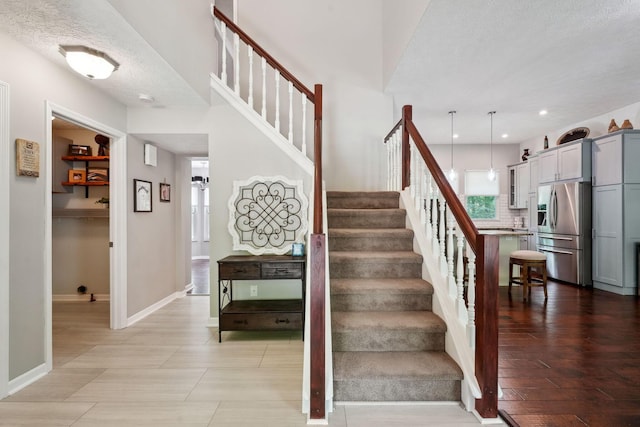 5191 Hialeah Ct, Columbus, OH 43221 - stairway featuring baseboards, recessed lighting, and a textured ceiling