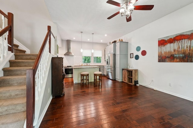 5191 Hialeah Ct, Columbus, OH 43221 - living area with dark wood-type flooring, stairway, ceiling fan, recessed lighting, and baseboards