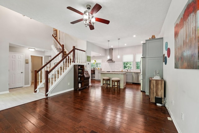 5191 Hialeah Ct, Columbus, OH 43221 - living room with a ceiling fan, wood-type flooring, stairs, baseboards, and recessed lighting