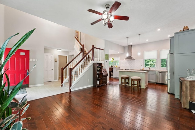5191 Hialeah Ct, Columbus, OH 43221 - living area featuring a ceiling fan, dark wood finished floors, stairs, recessed lighting, and baseboards
