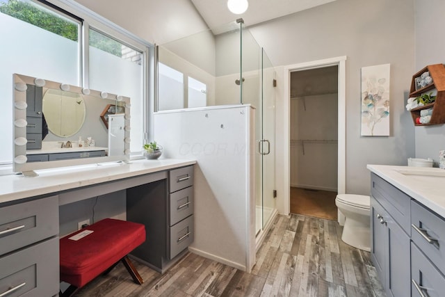 5191 Hialeah Ct, Columbus, OH 43221 - full bath with vanity, a stall shower, wood finished floors, toilet, and a spacious closet