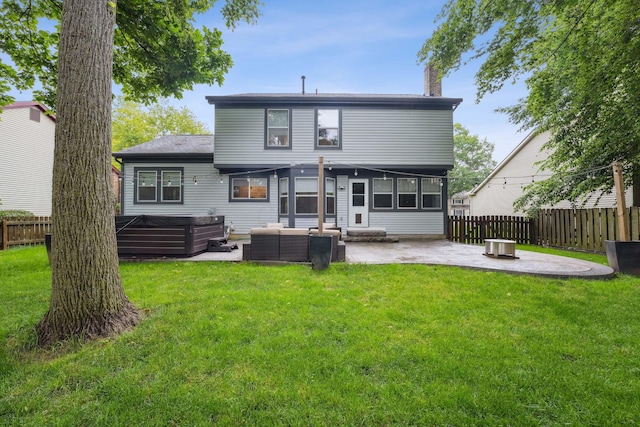 5191 Hialeah Ct, Columbus, OH 43221 - back of house with a patio, a hot tub, an outdoor living space, and a chimney