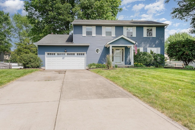 8732 Eastfield Ct, Pickerington, OH 43147 - colonial-style house with concrete driveway, a front lawn, and a garage