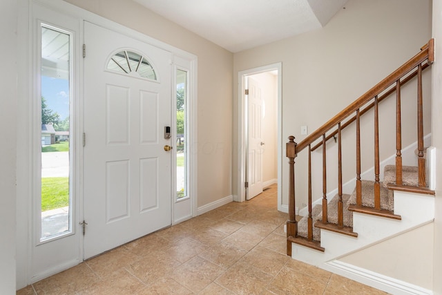 8732 Eastfield Ct, Pickerington, OH 43147 - foyer entrance with stairway and light stone finish floors