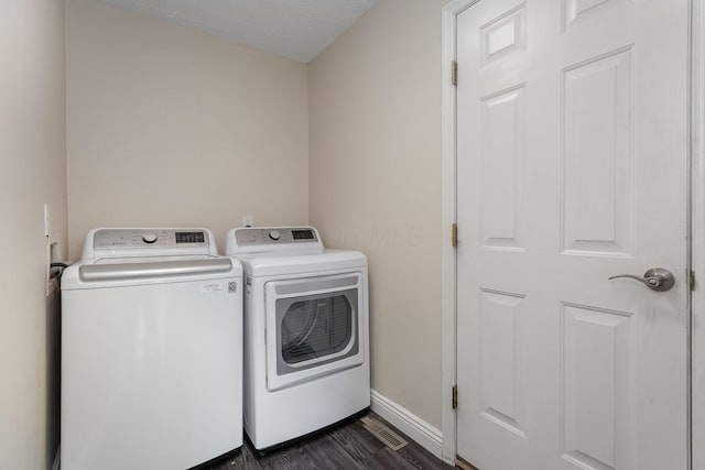 8732 Eastfield Ct, Pickerington, OH 43147 - washroom featuring separate washer and dryer and dark wood-style flooring