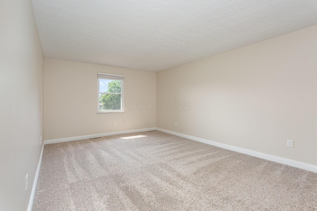 8732 Eastfield Ct, Pickerington, OH 43147 - empty room with light colored carpet and a textured ceiling