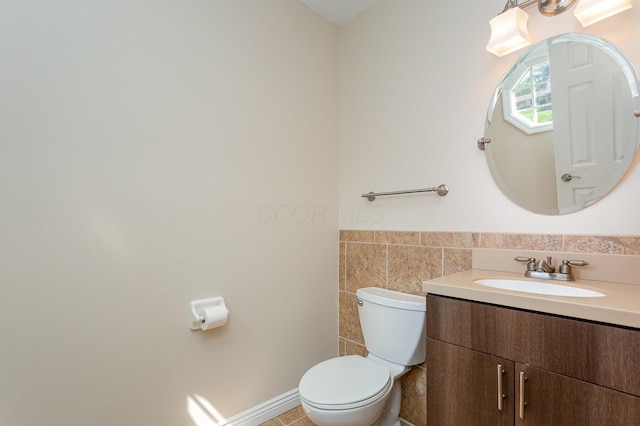8732 Eastfield Ct, Pickerington, OH 43147 - half bathroom with vanity, a wainscoted wall, tile walls, and tile patterned floors