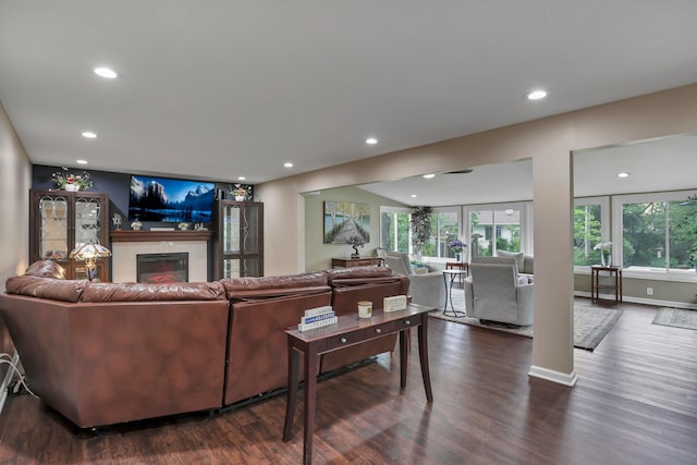 68 Nadine Pl N, Westerville, OH 43081 - living room with dark wood-type flooring, plenty of natural light, recessed lighting, and a glass covered fireplace