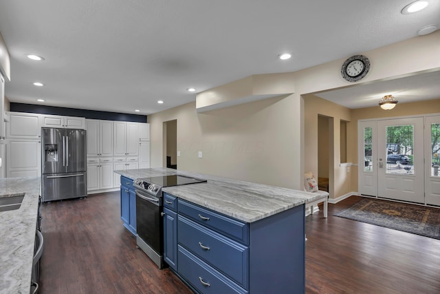 68 Nadine Pl N, Westerville, OH 43081 - kitchen featuring appliances with stainless steel finishes, blue cabinetry, dark wood-style flooring, white cabinets, and recessed lighting
