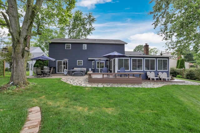 68 Nadine Pl N, Westerville, OH 43081 - rear view of house featuring a patio, a deck, a chimney, and a yard
