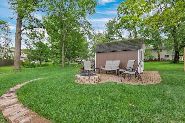 68 Nadine Pl N, Westerville, OH 43081 - view of grassy yard with a shed, a fire pit, and a patio