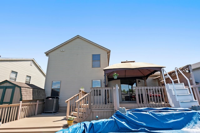 4686 Gilman Rd, Columbus, OH 43228 - rear view of property with a gazebo, a deck, and cooling unit
