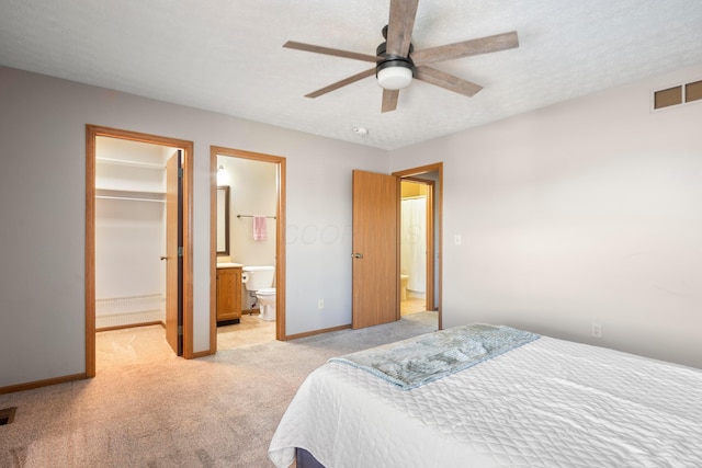 4686 Gilman Rd, Columbus, OH 43228 - bedroom with light colored carpet, a spacious closet, baseboards, connected bathroom, and a closet