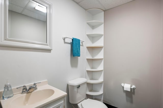 4686 Gilman Rd, Columbus, OH 43228 - half bath featuring a drop ceiling, toilet, and vanity