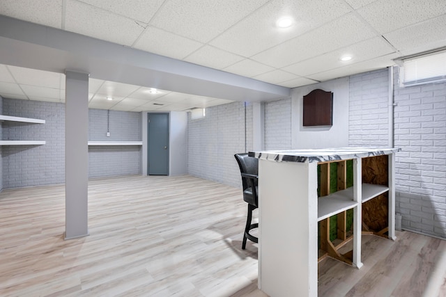 4686 Gilman Rd, Columbus, OH 43228 - bar area with brick wall, a drop ceiling, and wood finished floors