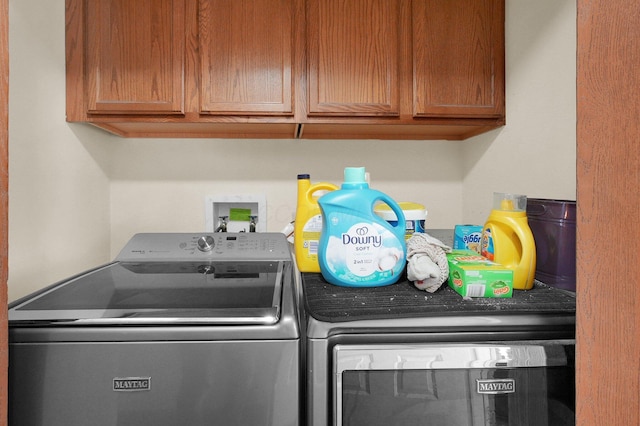 452 Samantha Cir Unit 10, London, OH 43140 - laundry area featuring washer and clothes dryer and cabinet space