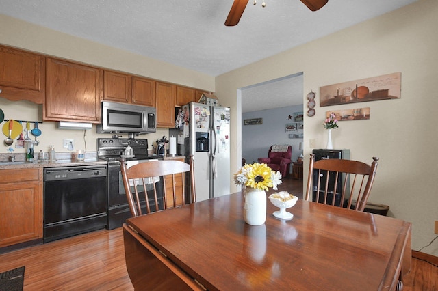 452 Samantha Cir Unit 10, London, OH 43140 - dining room with ceiling fan and light wood-style floors