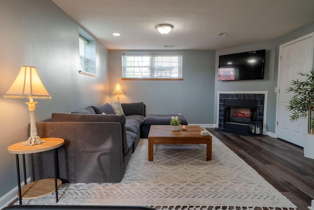5834 Aristides Way Unit 10, New Albany, OH 43054 - living room with wood finished floors, a tile fireplace, and recessed lighting