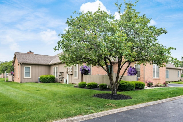 2423 Hooverside Ln, Grove City, OH 43123 - view of front facade featuring a chimney and brick siding