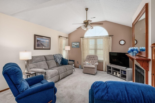 2423 Hooverside Ln, Grove City, OH 43123 - living room featuring lofted ceiling, ceiling fan, carpet flooring, baseboards, and a textured ceiling