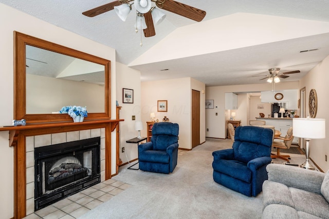 2423 Hooverside Ln, Grove City, OH 43123 - living room with a ceiling fan, a fireplace, light colored carpet, lofted ceiling, and baseboards