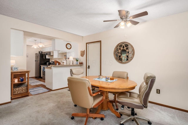 2423 Hooverside Ln, Grove City, OH 43123 - dining space featuring light carpet, ceiling fan, and baseboards