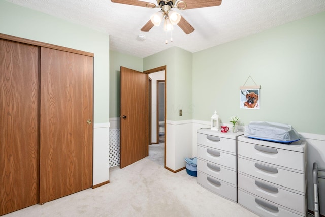 2423 Hooverside Ln, Grove City, OH 43123 - bedroom featuring light carpet, a closet, a textured ceiling, and ceiling fan