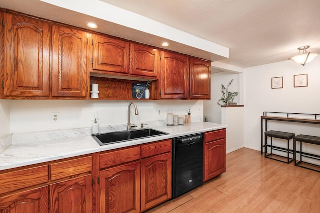 815 Savannah Dr, Columbus, OH 43228 - kitchen with dishwasher, light wood-style floors, light countertops, recessed lighting, and brown cabinets