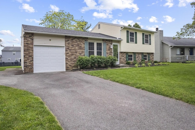 4150 Demorest Rd, Grove City, OH 43123 - split level home with driveway, brick siding, and an attached garage