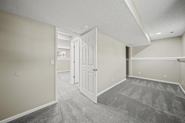 4150 Demorest Rd, Grove City, OH 43123 - below grade area featuring a textured ceiling, baseboards, and carpet floors