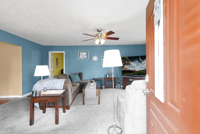 13111 King Rd NE, Thornville, OH 43076 - living area with ceiling fan, carpet floors, and baseboards