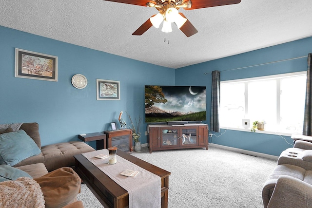 13111 King Rd NE, Thornville, OH 43076 - living room featuring a ceiling fan, carpet, a textured ceiling, and baseboards