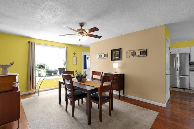 13111 King Rd NE, Thornville, OH 43076 - dining room with wood finished floors, ceiling fan, baseboards, and a textured ceiling