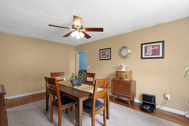 13111 King Rd NE, Thornville, OH 43076 - dining area featuring ceiling fan, wood finished floors, and baseboards