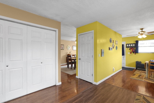 13111 King Rd NE, Thornville, OH 43076 - hall featuring wood finished floors, a textured ceiling, and baseboards
