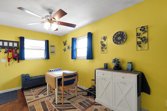13111 King Rd NE, Thornville, OH 43076 - home office with ceiling fan, dark wood finished floors, baseboards, and a textured ceiling