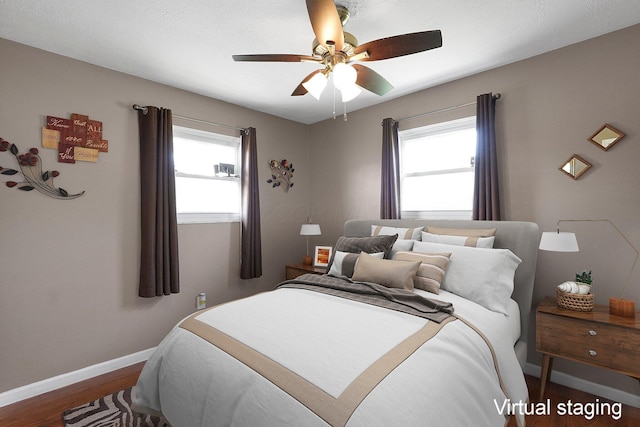 13111 King Rd NE, Thornville, OH 43076 - bedroom with multiple windows, baseboards, dark wood-type flooring, and ceiling fan