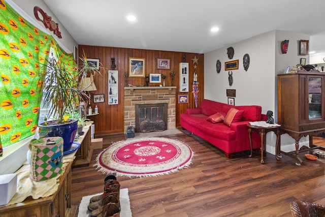 565 S Kellner Rd, Columbus, OH 43209 - living room with wood finished floors, wooden walls, a stone fireplace, and recessed lighting