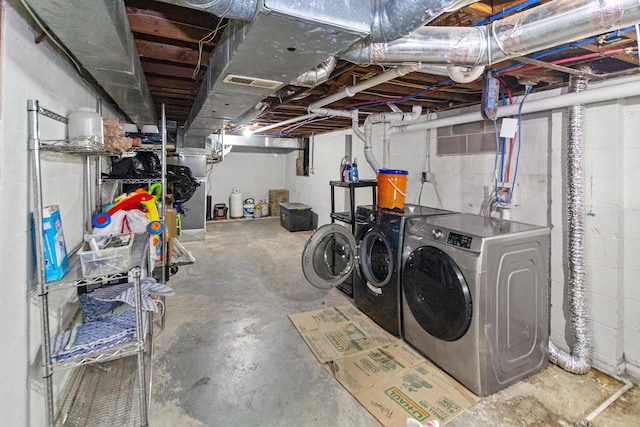 565 S Kellner Rd, Columbus, OH 43209 - unfinished basement with washing machine and dryer and concrete block wall