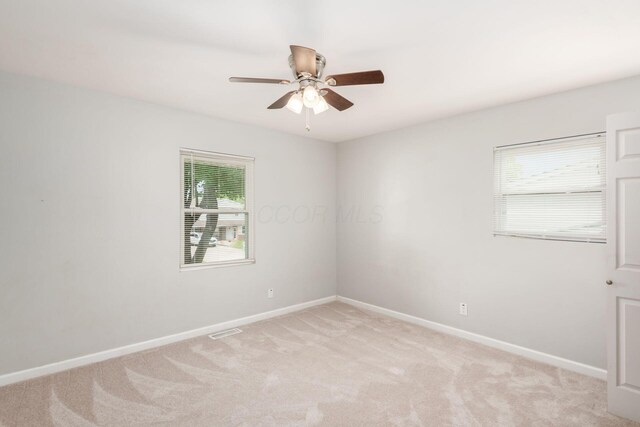 5186 Meadowbrook Dr, Columbus, OH 43207 - empty room featuring a ceiling fan, light carpet, and baseboards