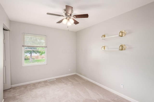5186 Meadowbrook Dr, Columbus, OH 43207 - unfurnished bedroom featuring baseboards, light carpet, and ceiling fan